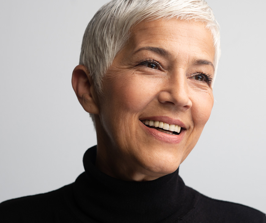 Woman smiling and looking to the side