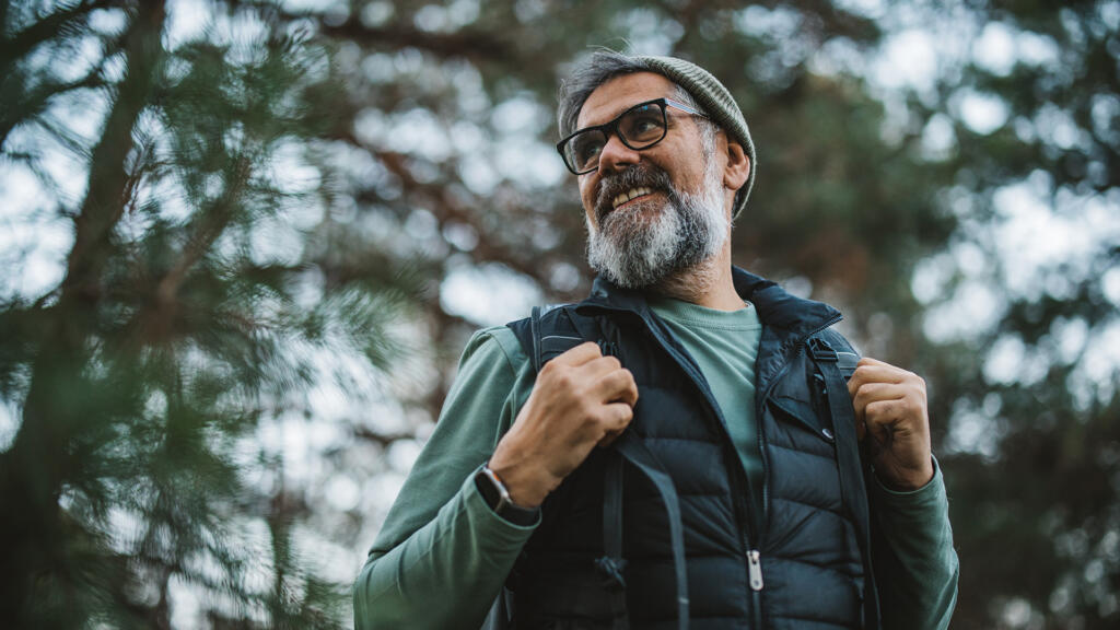 Man hiking and looking at surroundings
