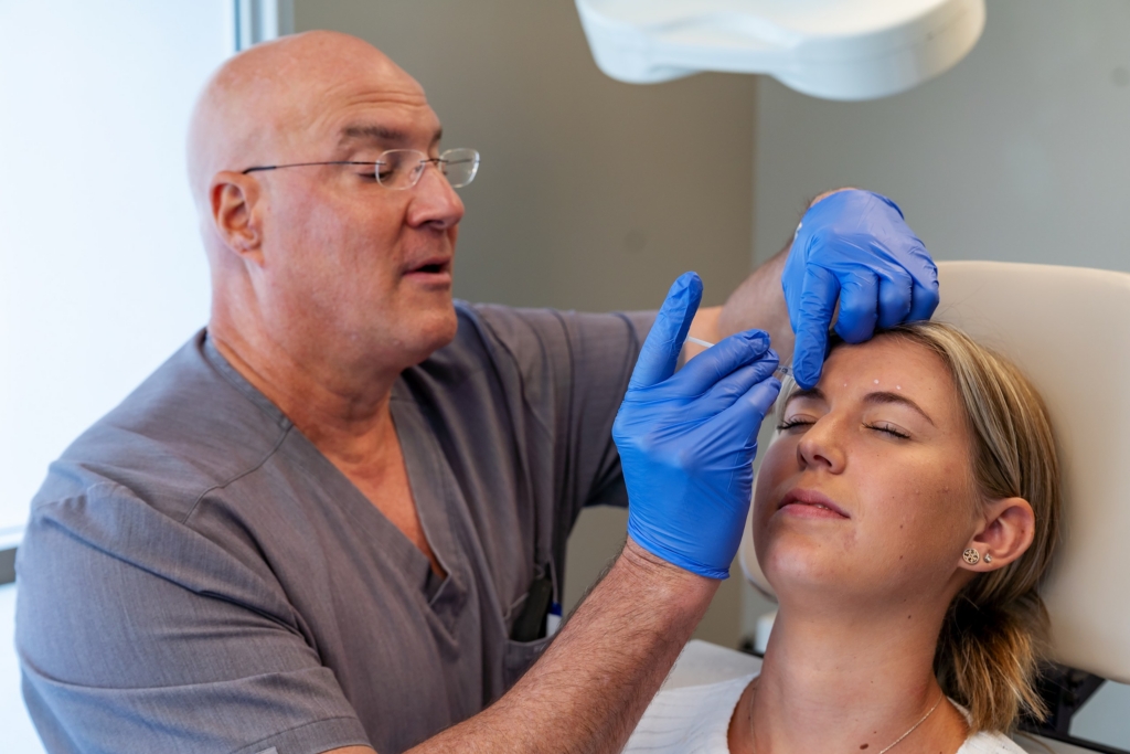Dr. Jay Lucas administering a BOTOX injection to a patient at The Lucas Center in Knoxville
